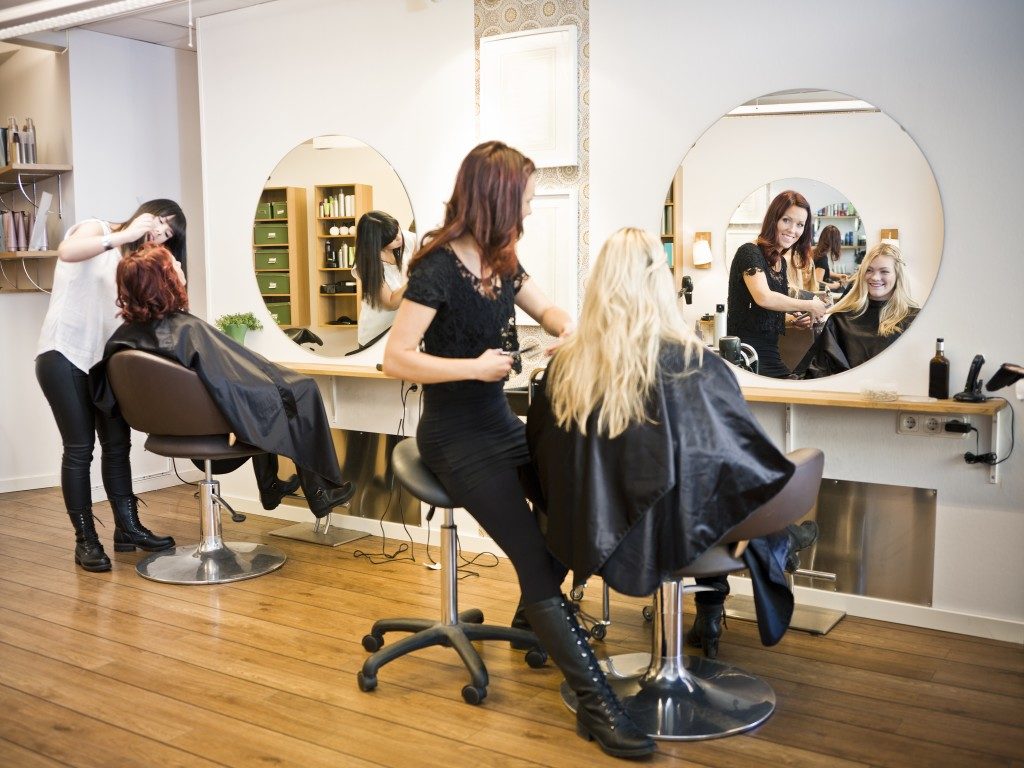 Friends having a hair treatment in a salon