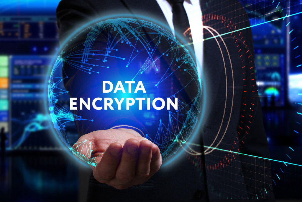 data encryption concept business model on businessman's hand