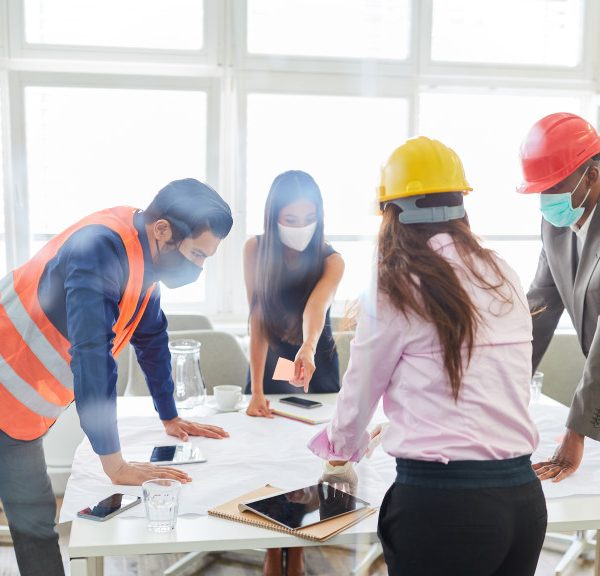 A group of engineers and architects discussing about a construction project