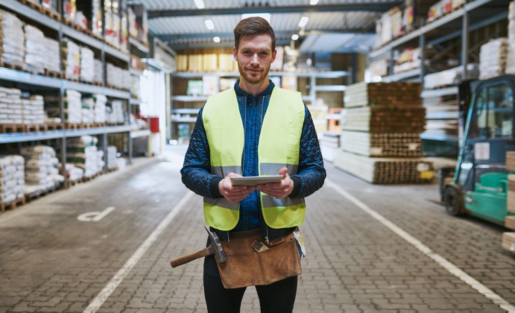 warehouse worker holding a tablet