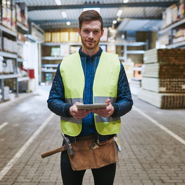 warehouse worker holding a tablet