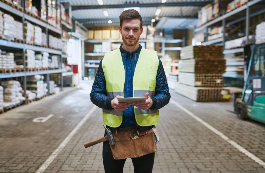 warehouse worker holding a tablet